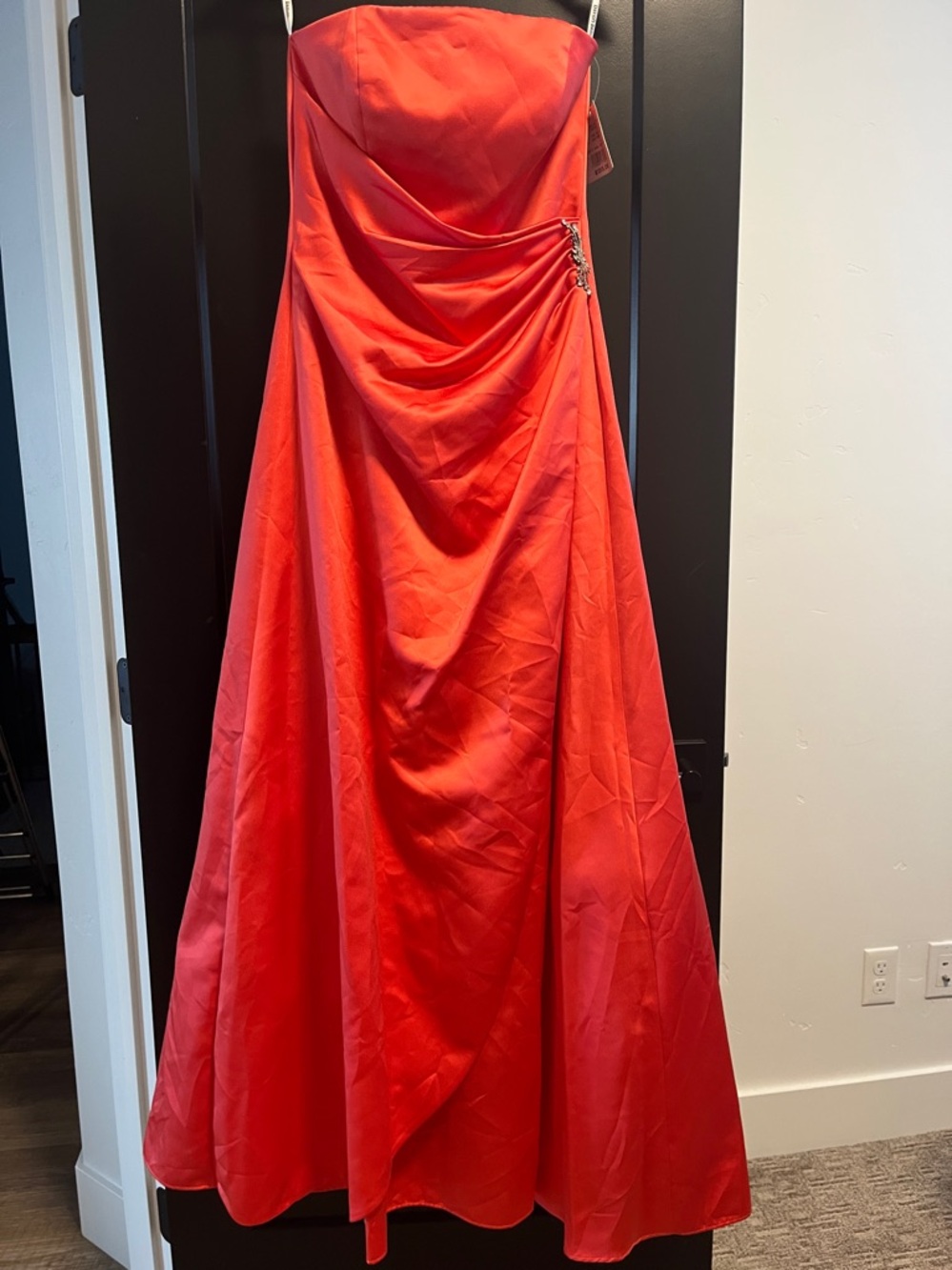 David's Bridal Strapless Formal Dress with beautiful side appliqué. Guava color